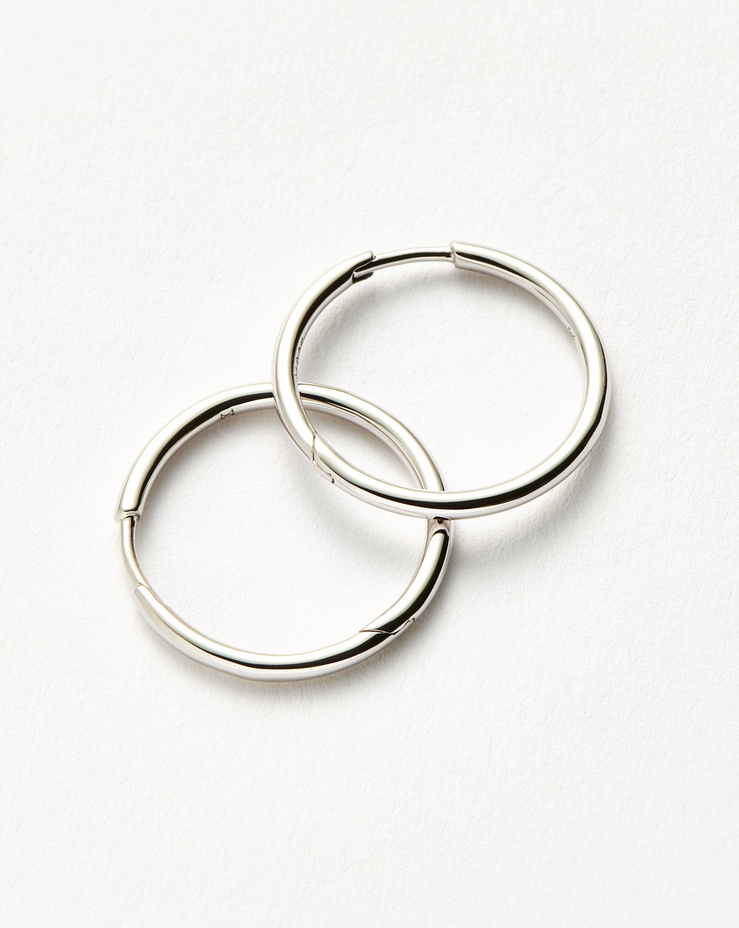 classic-small-hoop-earrings-rhodium-plated-on-recycled-sterling-silver-earrings-missoma-899035_86de6d29-f5ad-463a-9afd-c35827812c56.jpg