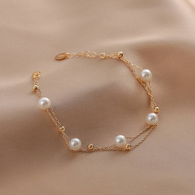 dr-bracelets-layered-freshwater-pearl-bracelet-14k-yellow-gold-36626634899689_ecac3650-db89-4b9c-ab36-5c16fd3ed6c4.jpg