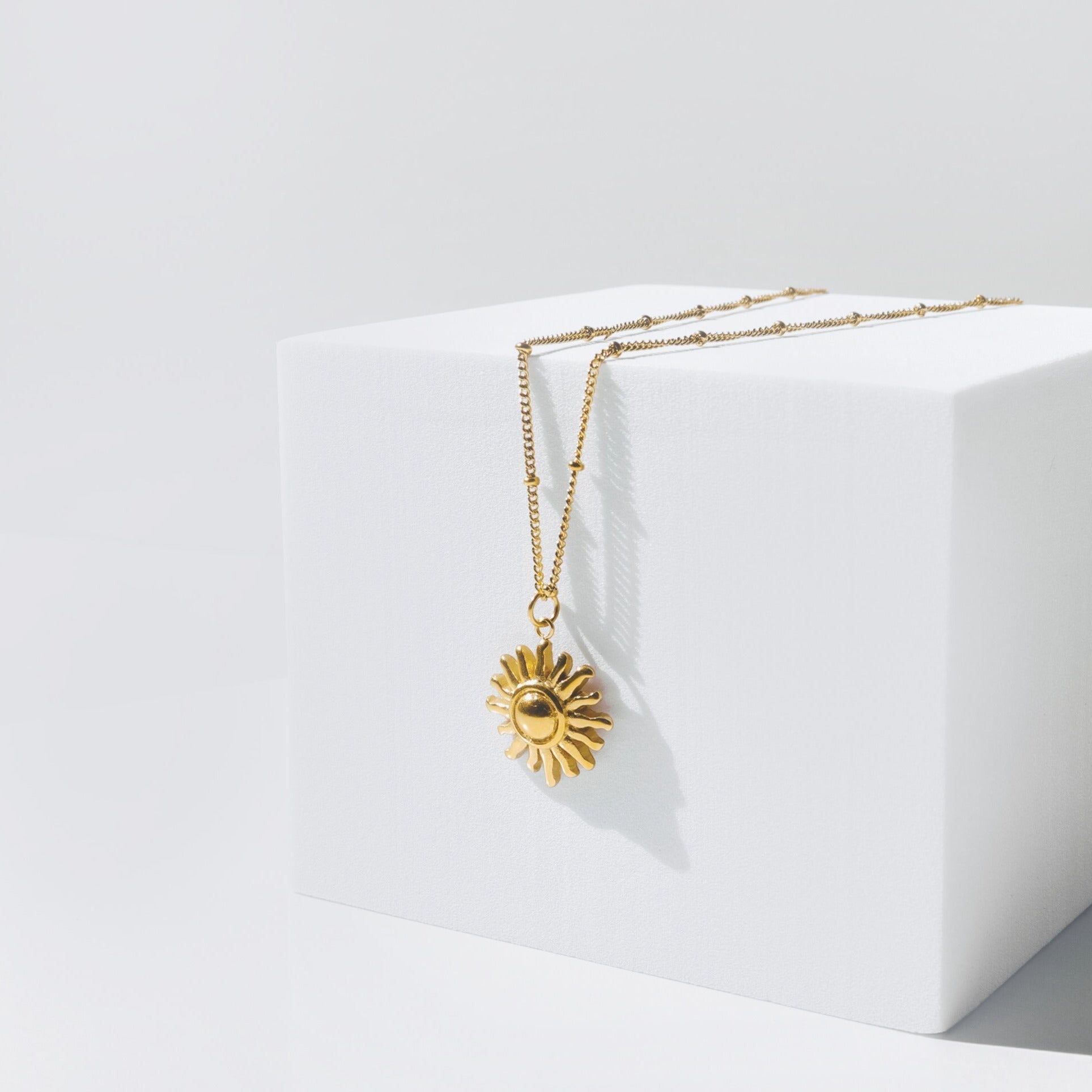 gold-sun-necklace_61005d00-0f0a-4287-aa79-d784372f95a1.jpg