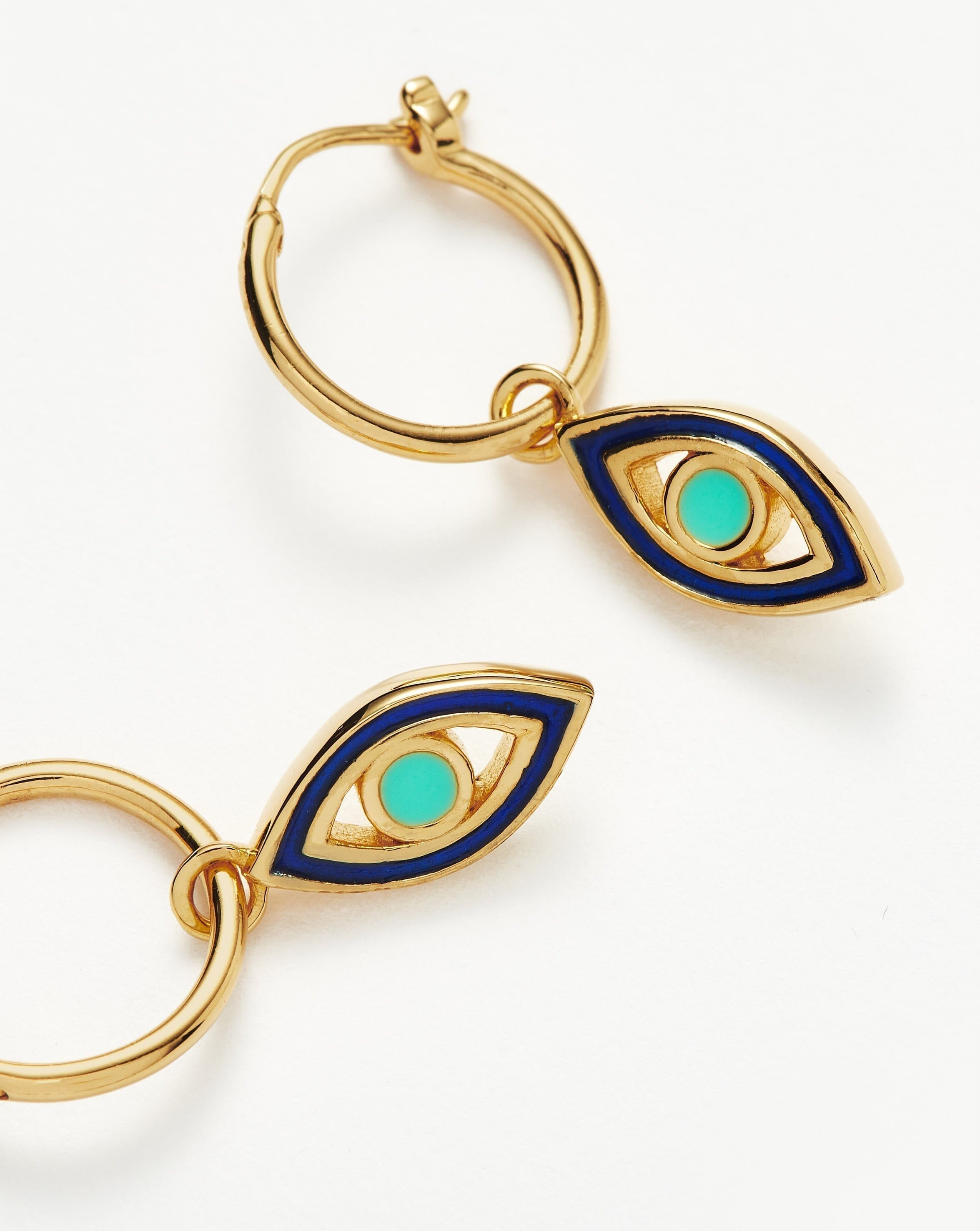 good-vibes-enamel-evil-eye-mini-charm-hoop-earrings-18ct-gold-plated-vermeilaqua-navy-earrings-missoma-224828_73495946-d9ec-44fe-93d3-652566ca4eab.jpg