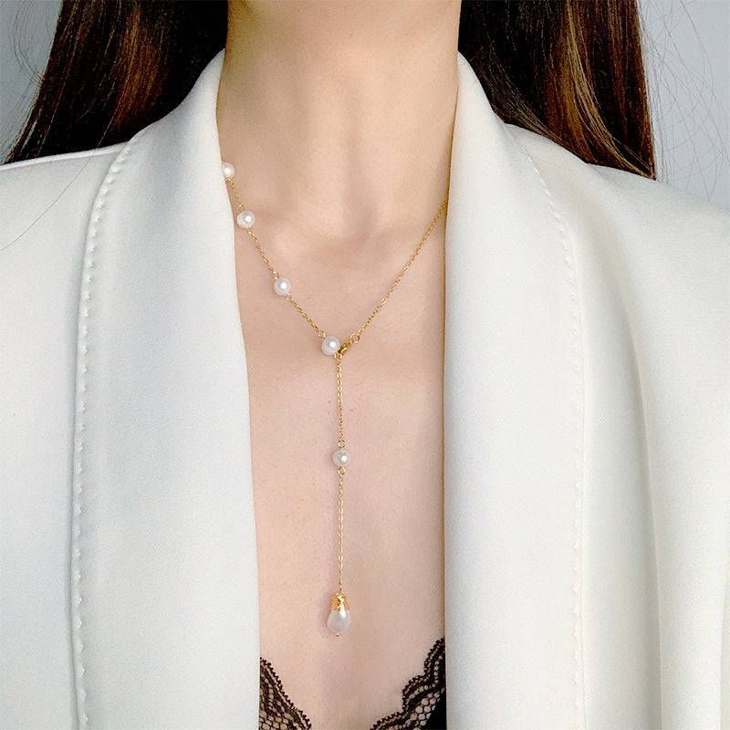 wh-necklaces-elle-one-side-pearl-long-chain-necklace-36626602164457_c4c1da9c-6ef6-48eb-9dad-6f3cce1b1c08.jpg