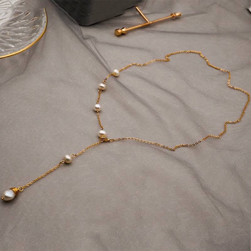 wh-necklaces-elle-one-side-pearl-long-chain-necklace-36626602492137_e6b5c5bf-fe2f-4d42-a25c-706dcb517dc9.jpg