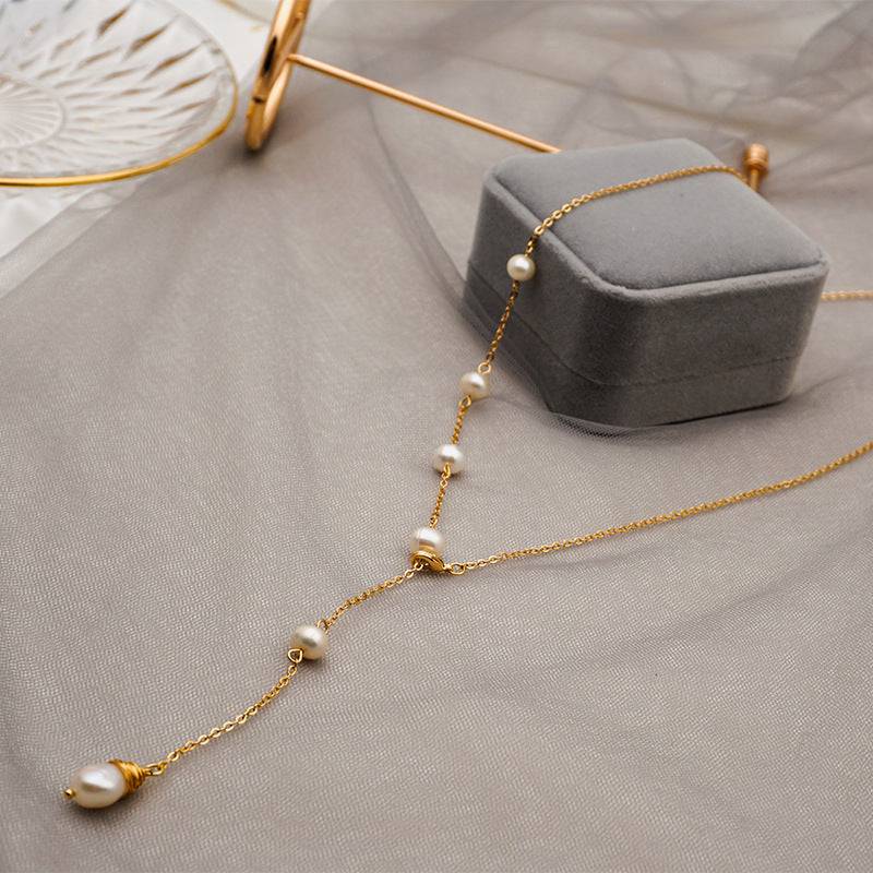 wh-necklaces-elle-one-side-pearl-long-chain-necklace-36626602590441_c8b6ce6b-9cbe-438b-b900-cb7e01022c37.jpg