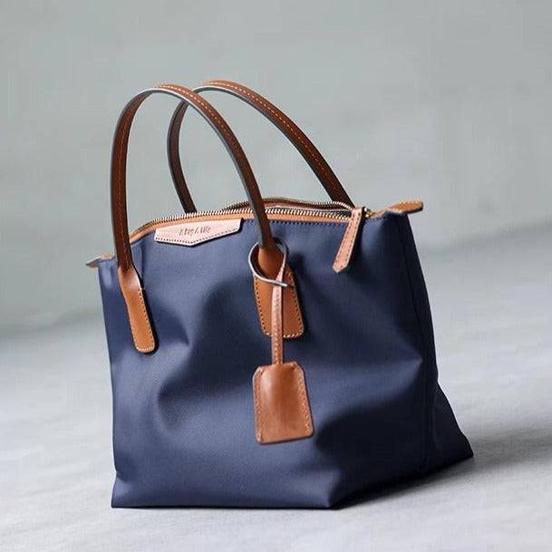 xq-handbags-emtote-shoulder-bag-blue-36626714689769_6d732cab-a9fc-474a-be15-7b534ad34d45.jpg